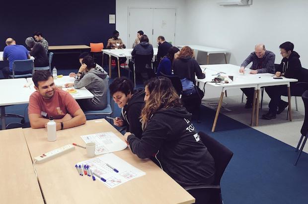 Developers working in pairs during Code Retreat
