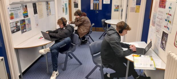 Three children completing online tuition