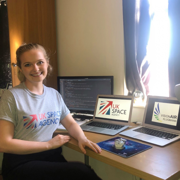 Ellie at her desk with code open
