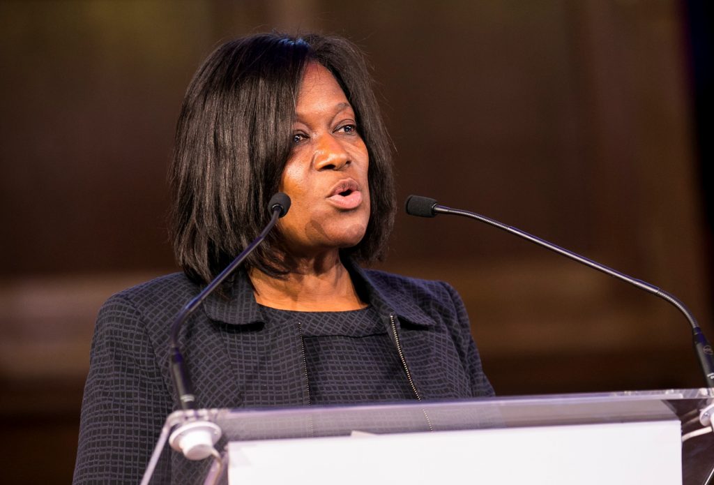 Jacky Wright speaking at a lecturn
