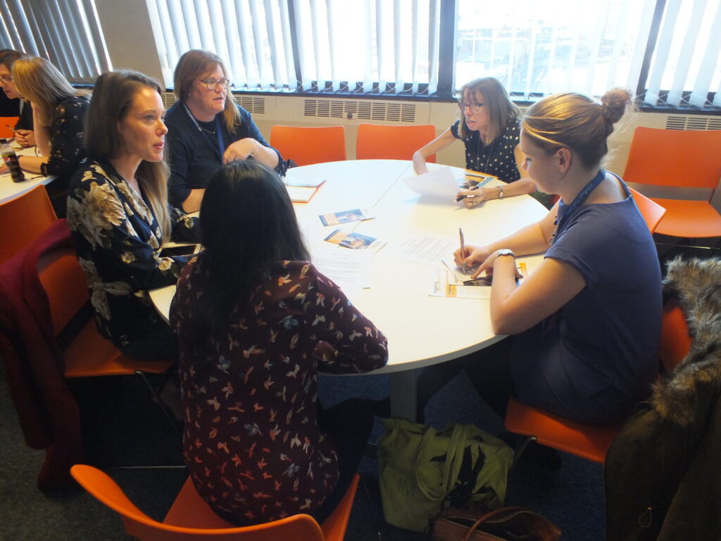 Round table discussion featuring 5 women.