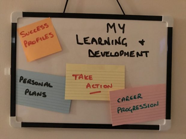 Notice board with the title My Learning And Development plus cards saying Success Profiles, personal plans, triple action, career progression.