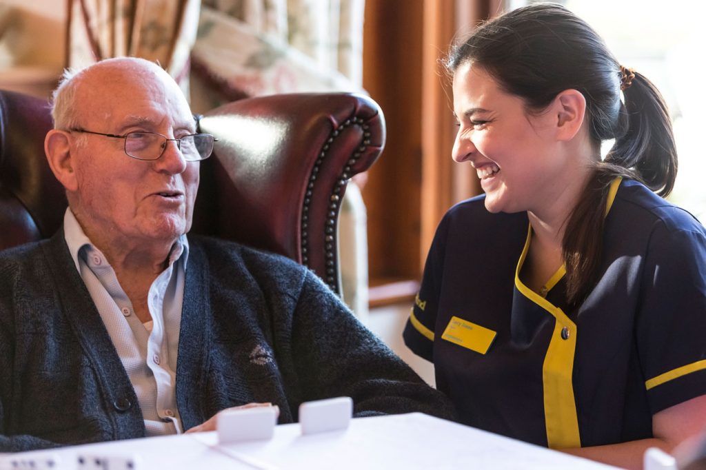 Male care home resident and care team member