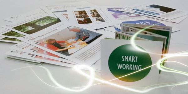 Leaflets, the text 'smarter working' and electricity sparks