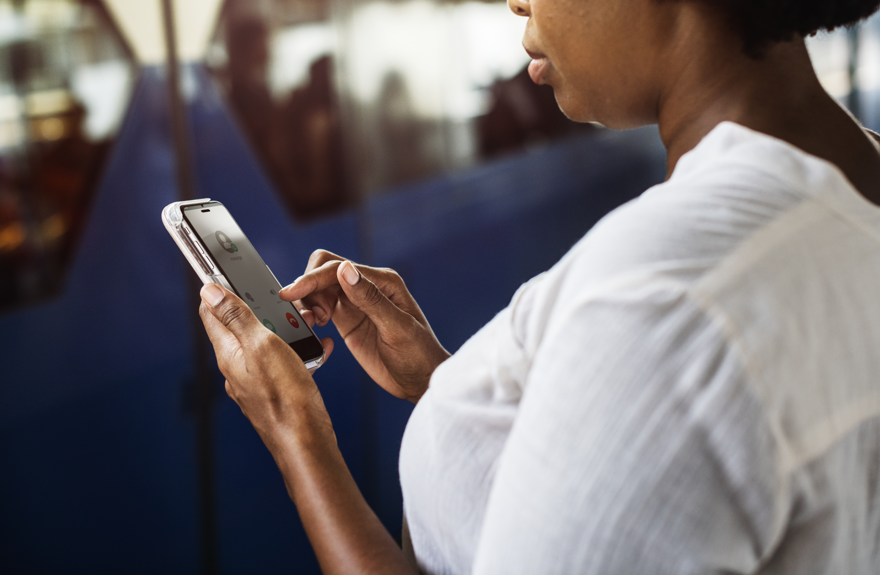 This image is a representation of a social worker checking her phone.