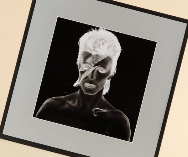 Save instantly on luxury prints An artistic negative photo portrait of David Bowie