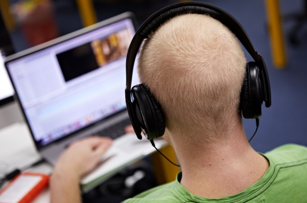 Man using social media on a laptop