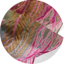 Raga Designs Detial of a multicoloured scarf with gold thread detailing.