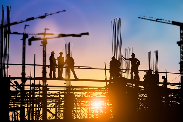 Silhouette of workers on a construction site