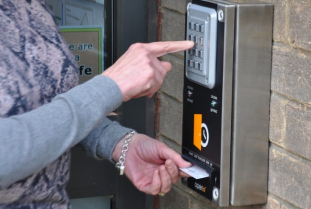Open+ in action: a visitor uses her library card to access the library.