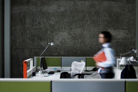 Businessman walking with documents