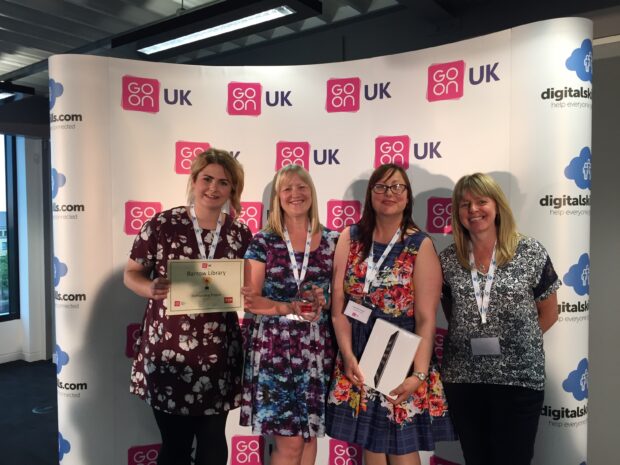 Staff at Barrow library with their award for digital engagement work. Photo credit: Cumbria libraries