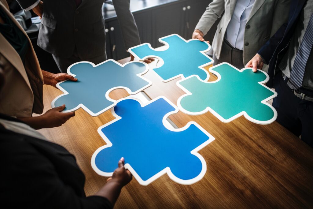 four pieces of large jigsaw being put together