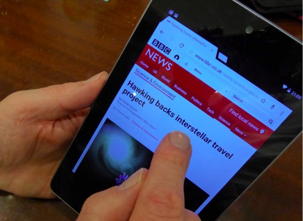 Using a table device to browse the internet. Photo credit: Julia Chandler/Libraries Taskforce
