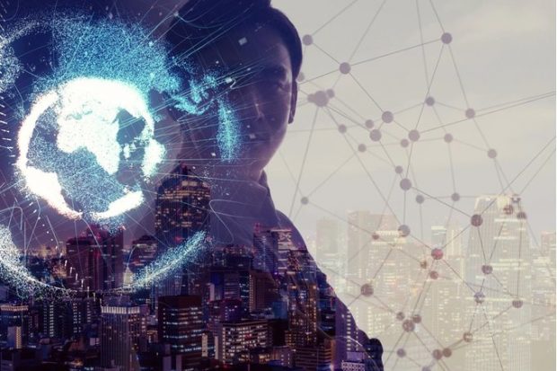 A graphic image of a man holding a lit up world globe