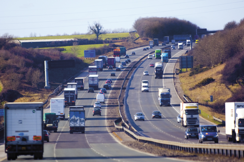 busy motorway with traffic ravelling in both directions in both
