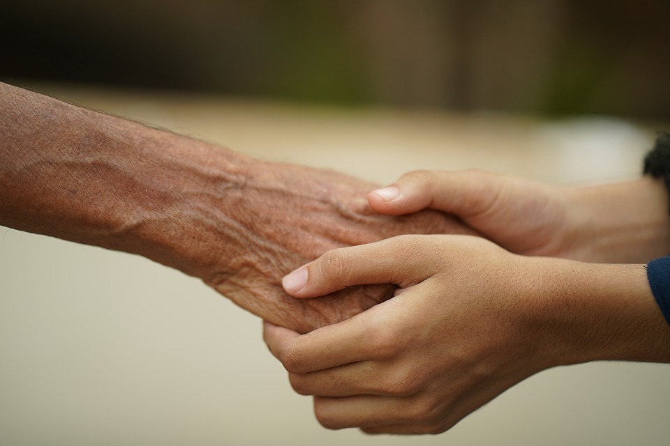 Image of clasped hands to demonstrate support