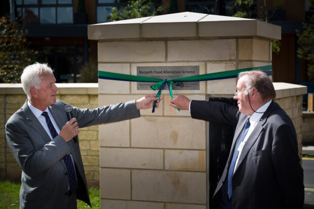 The moment Environment Agency Chairman Sir Philip Dilley and Cllr Ian Swithenbank from Northumberland County Council open the scheme