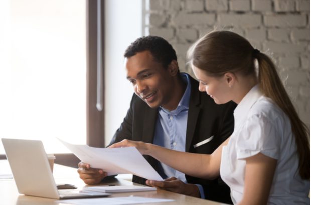 A woman offering advice to a business owner.