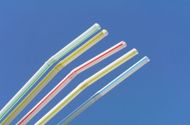 Five drinking straws against the blue sky