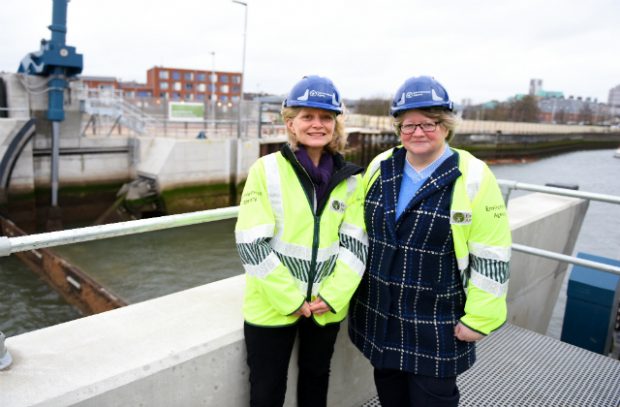 Image of Flood Minister standing by river in Ipswich.