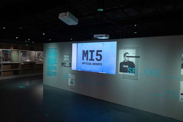 Image of the opening wall of the MI5 exhibition with the logo and image of a spy