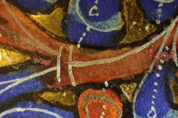 Blue, red and gold pigments under a microscope