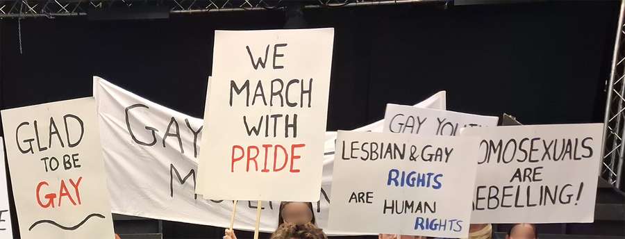 Placards used to fight for LGBTQ+ rights, as used during a theatre performance