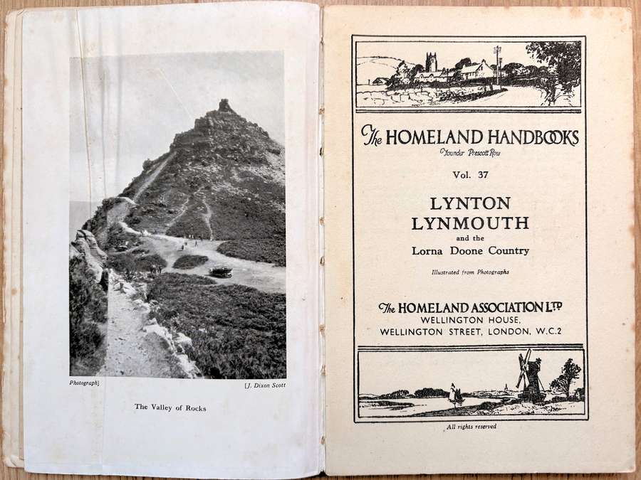 A open book. On the left page is a black and white photograph of a mountain and text is on the right page.