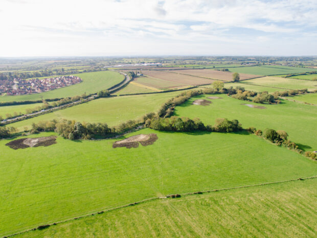 A pond in a field, part of a wetlands creation project in Buckinghamshire