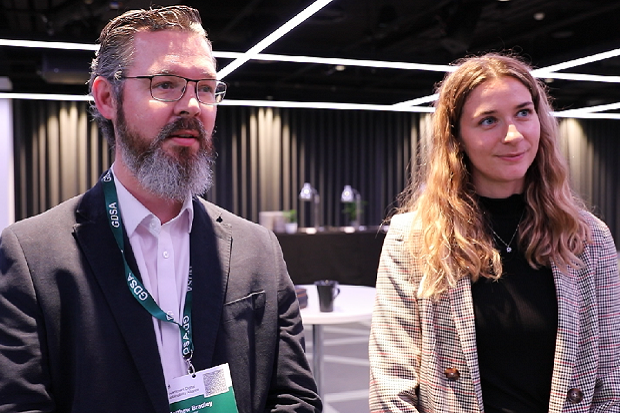 A man and a woman standing in a room.