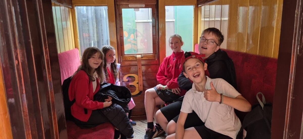 Children in heritage train carriage