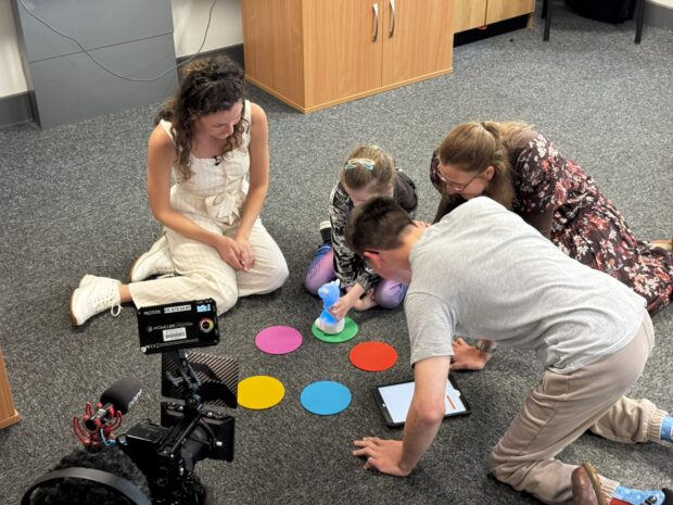 An image of Katie demonstrating Moti Me to children