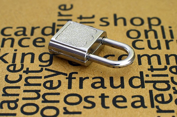 Image of a padlock against words such as fraud and secure.