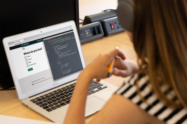 A person using the prototype kit on a laptop.