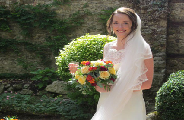 Joanna wearing the wedding dress she made.