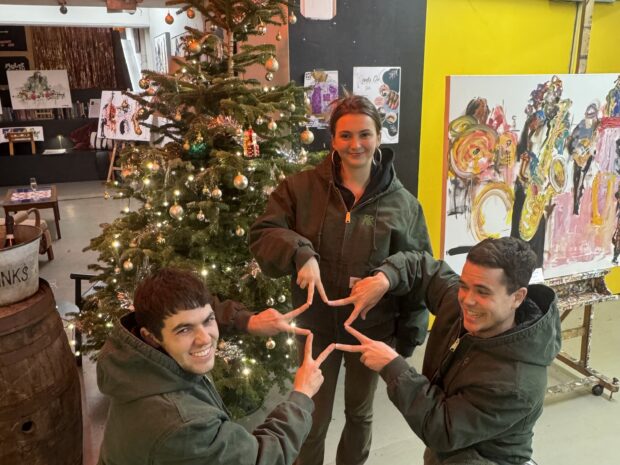 ORNA® team in front of a Christmas tree