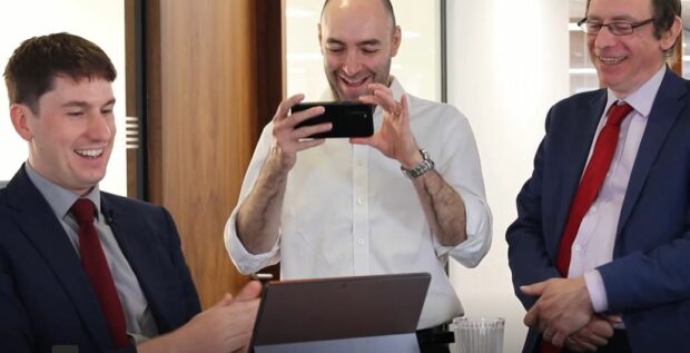 Thomas Gibb, Chief Compliance Officer from global attorneys, Murgitroyd, filing the first patent using the new service. Witnessed by Transformation Communications Lead, Simeon Bowen and Divisional Director of Patents, Julyan Elbro.