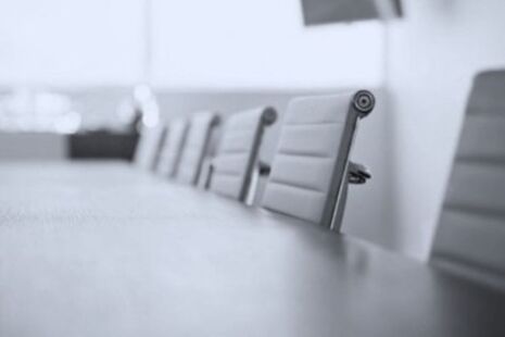 Meeting room table and chairs set up for an advisory committee meeting.