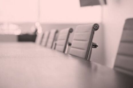 Meeting room table and chairs set up for an advisory committee meeting.