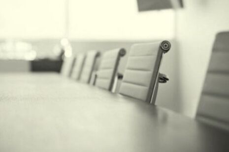 Meeting room table and chairs set up for an advisory committee meeting.