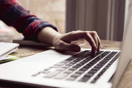 Person typing on a laptop