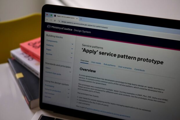 A laptop screen shows the Design System and the 'Apply' service pattern prototype.