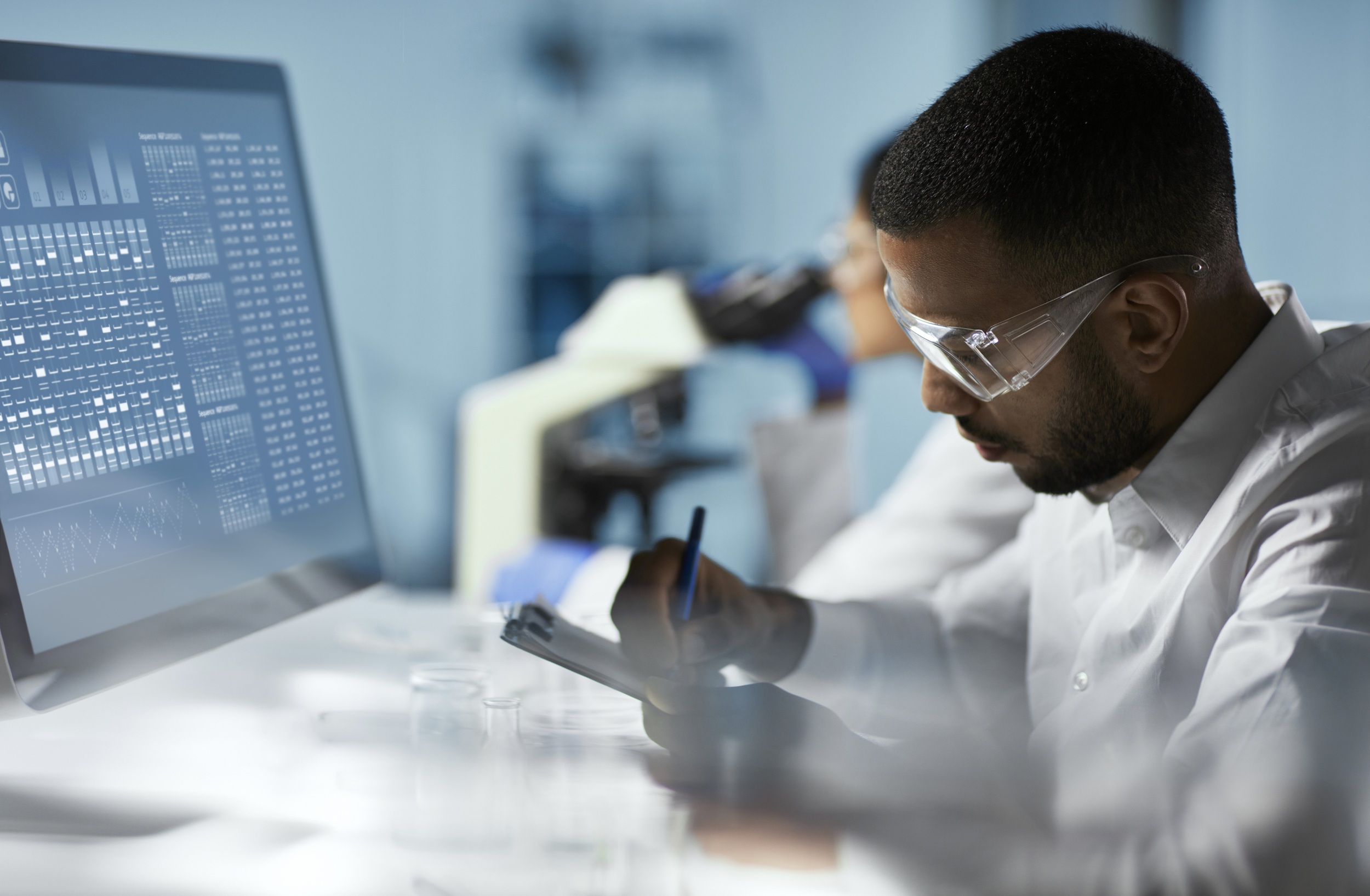Scientist works on computer in modern laboratory. Credit: iStock Photo