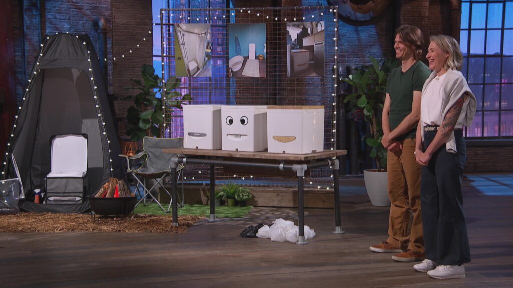 An image of Compo co-founders Richard and Erica stood in the Den by their off-grid toilets.