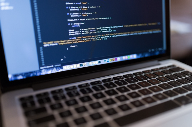 Laptop screen with coding on
