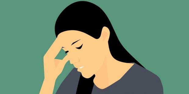 Image shows a stressed women