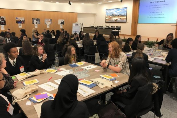 An engineer describing her role to young pupils.