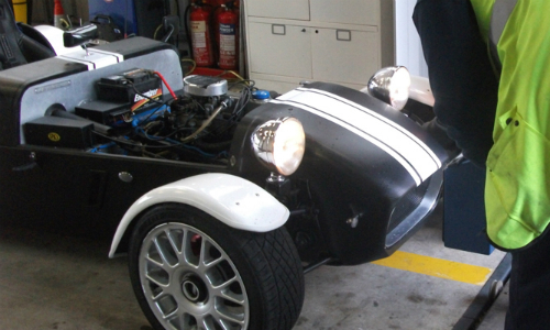 A DVSA inspector examines a kit car
