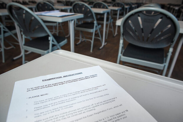 Exam instructions on a desk.